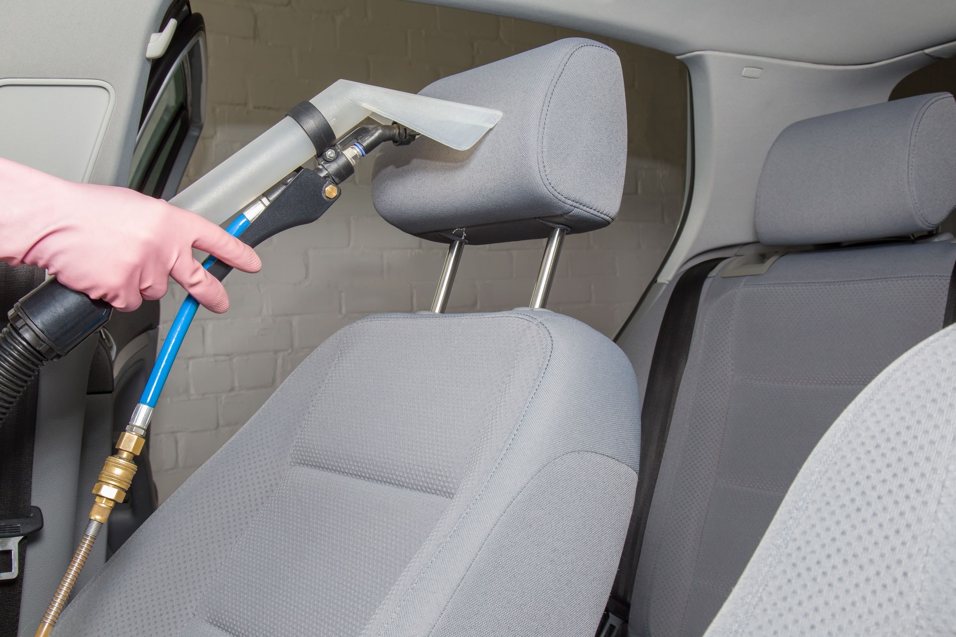 Clean car interior after light gray textile seats chemical cleaning.